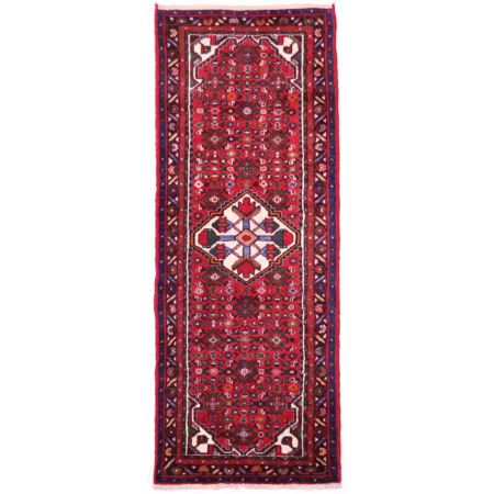 Hosseinabad runner: red field decorated with herati motifs and with cream medallion and corners.