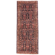 Old Belouch Runner with geometric asymmetrical design on a charcoal field with detail colours of teal green, terracotta and beige.