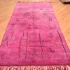 Purple Moroccan Berber Beni Mrirt Carpet with ancient tribal symbols. Handmade, wool pile hand-knotted onto wool.