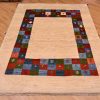 Funky handknotted modern Gabbeh Rug with plain natural beige field and a jazzy multi-colour chequerboard inset border.
