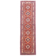 Traditional Kazak runner with rust-red field, beige border & geometric 7 medallion design.