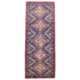 Blue chobi strip with rust, yellow and green design.
