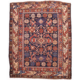 Antique Bidjov Shirvan rug circa 1900, striking multi-colour geometric design on a dark blue ground.