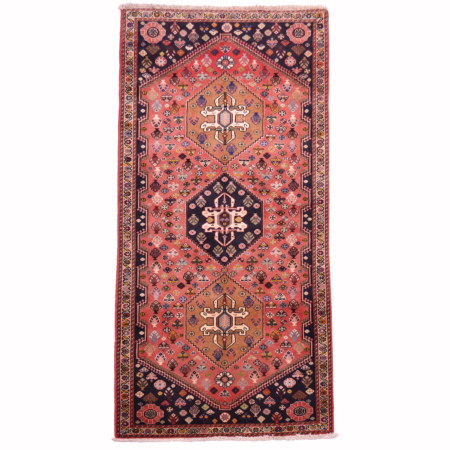 Qashqai short runner with soft terracotta ground & geometric 3 medallion design.