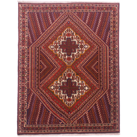 Persian Afshar rug with geometric double medallion design in colours of rust, navy, cream, orange and green.