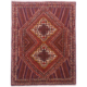 Persian Afshar rug with geometric double medallion design in colours of rust, navy, cream, orange and green.