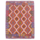 Handwoven Purple Kelim rug with geometric design. Colours include purple, orange, cream, green and mustard.