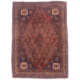Fine quality Qashquli rug antique with all-over field theme of boteh motifs on a chestnut field with navy corners and beige main border.