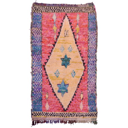 Vintage Boucherouite carpet with yellow diamond on a pink field.
