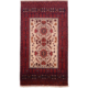 Fine Belouch rug with beige ground and 2 floral medallions.