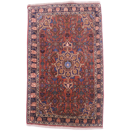 Wonky Zanjan rug with medallion design centrepiece and herati field.