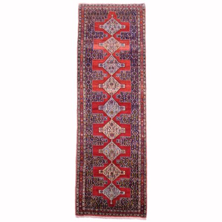 Senneh runner with Herati design and medallion design.