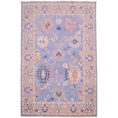 Afghan Oushak carpet with blue field, grey border as well as details of navy, green, yellow, beige and lilac.