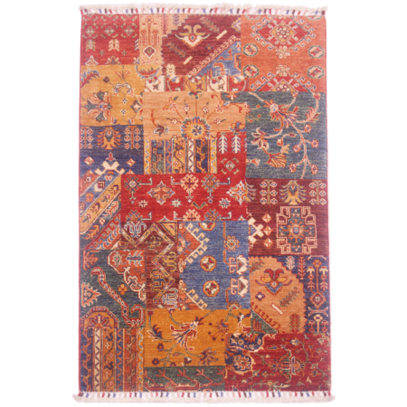 Hand-knotted wool pile Afghan Patchwork design rug with a mixed assortment of geometric patterns.