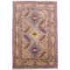 Hand-knotted wool pile Afghan Kazak carpet with triple medallion design on a grey field.