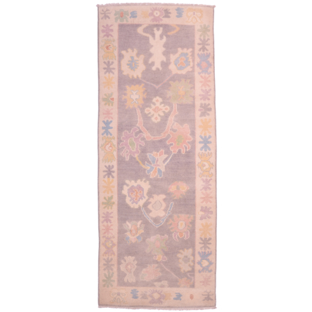 Oushak runner with all over floral design on a grey ground.