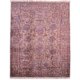 Fine Sultani rug with floral theme on a grey-brown ground with detail shades of blue and orange.
