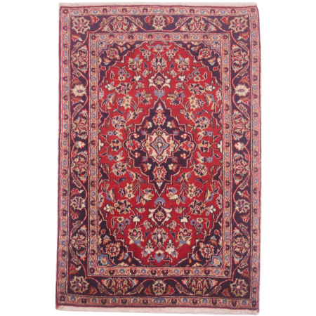Traditional red and blue Persian Kashan rug with floral medallion design.