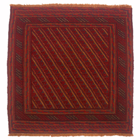 Red and blue Afghan Mushwani rug with geometric design arranged in a diagonal proportional.