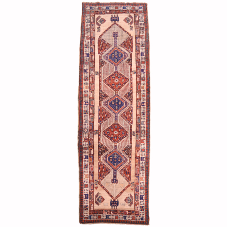 Antique Sarab runner with geometric medallion design on a natural beige ground.
