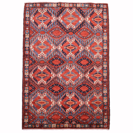 Antique style Beshir rug with all over design in colours of terracotta, blue and cream.