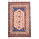 Old Turkish rug, cream with geometric design with detail colours in blue, orange/rust, and green.