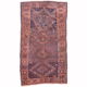 Shabby antique Luri tribal rug with wonky geometric design, colours of blue, terracotta, rust, apricot and cream.