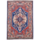 Kazak mat with Heriz design; geometric medallion design; colours of blue, red and cream.