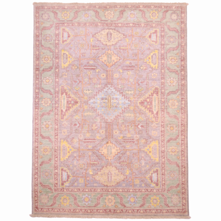 Serapi rug from Afghanistan pale colours: grey field with green border plus detail shades of pale blue, yellow and New York pink.