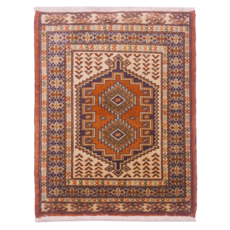 Hand-knotted Turkoman mat with charming geometric tribal medallion design. Colours of orangey-terracotta, navy, cream, green & light blue.